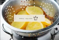Transfer the oranges to a colander and let drain t...