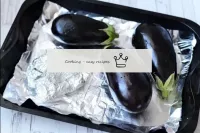 Place the prepared aubergines and garlic on a foil...