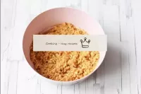 Pour both kinds of crumbs into a bowl. Pour in the...