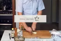 Peel the garlic. Finely chop half the garlic. ...