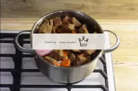 Return the beef to the pan. Pour in the hot beef s...