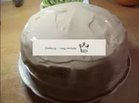 Coat the finished cake on all sides with the remai...