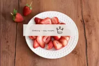 Wash the strawberries, remove the tails. Cut part ...