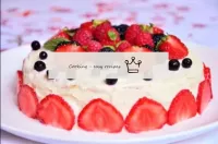 Pancake cake with curd cream and berries in the pa...