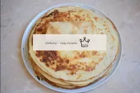 Twist the pancake around the edges and roll up. Th...