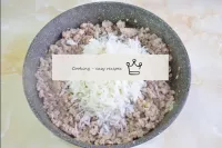 When the mince is ready, add the boiled rice to th...