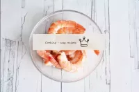 Clean the shrimp from the head and shell, leaving ...