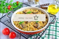 Bulgur with mushrooms and onions in the pan...