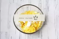 In a bowl, combine the grated eggs and cheese, bla...