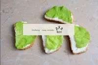 For each slice of bread, lay out a leaf of lettuce...