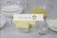 While the cakes are baking, make the custard. Meas...