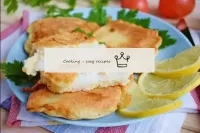 Battered cod fillet in frying pan...