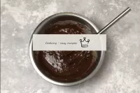 Add the melted chocolate. It should cool slightly,...