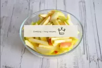 Wash the apple, dry, peel and cut into small bars....