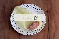 Put a little filling on the edge of each cabbage l...