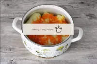 Put all the cabbage rolls in a deep saucepan. Spre...