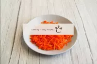 Pre-washed carrots in running water with a brush, ...