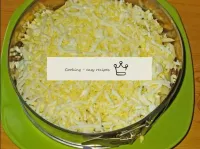 Put the grated eggs in a fourth layer. ...