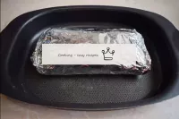 Wrap the brisket tightly in foil so that there are...