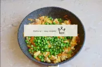 Add the green peas to the pan. Stir to make the pe...