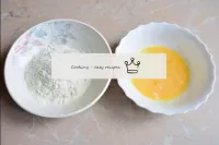 Prepare two batter bowls. In one, shake 2 eggs, an...