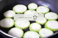 Fry the courgette pieces in a preheated frying pan...