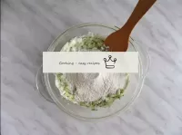 Pour in the flour sifted with baking powder and mi...
