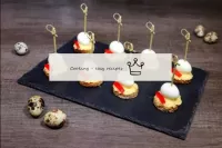 Canape with quail egg on skewers...