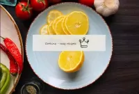 Rinse the lemon. Cut half of the citrus into thin ...