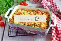 Remove the finished casserole from the oven and se...