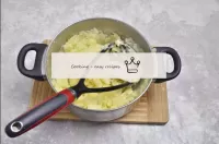 Mash the potatoes with a pusher. Put the butter in...