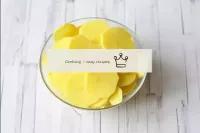 Peel the potatoes and cut into thin circles. The t...