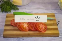 Wash the tomatoes and dry with paper towels. Cut t...