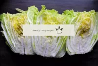 Place the cabbage on a flat surface or a large tra...