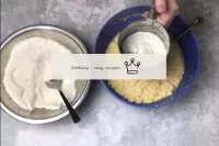 Start adding flour to the dough in portions, sifti...
