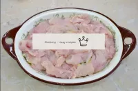 Spread the chicken fillet evenly throughout the sh...