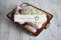 Carefully separate the skin of the chicken on the ...