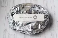 Cover the tin with foil or a lid and place the chi...