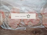 Place the fillet pieces over the plastic wrap at a...