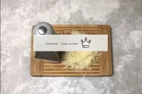 While the chicken is baking, grate the cheese. On ...