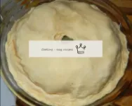 Cover the cake with a second layer of dough and ho...