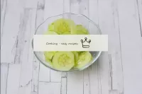 Wash the cucumber, dry and cut into thin circles. ...