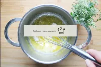 Pour in the flour and stir continuously with a whi...