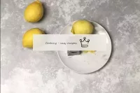 Wash and dry the lemons. Remove the zest from them...