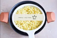 Put the ready-made pasta in a colander so that the...