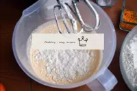 Sift the flour with baking powder and gradually po...