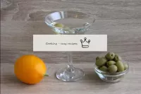In a classic serve, one olive is placed in a cockt...