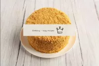 Cover the cake with crumbs on top and sides. You c...