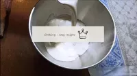 Transfer it to the bowl of the mixer and add the r...