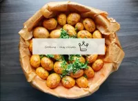 Remove the finished potatoes from the oven (readin...